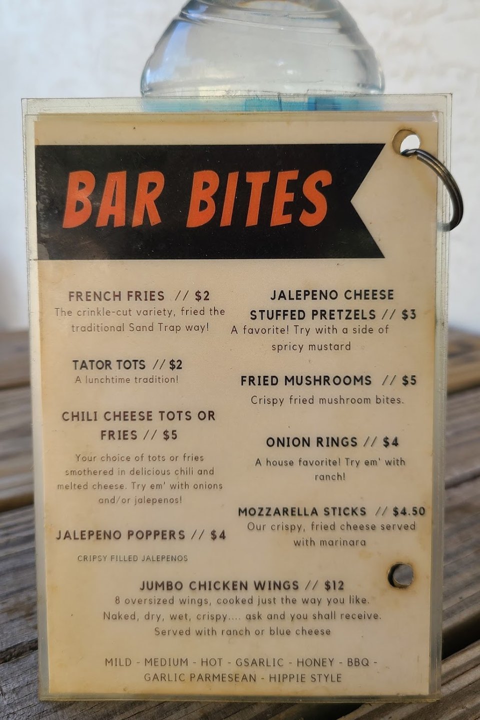Printed menu showing hearty bar and grill choices.